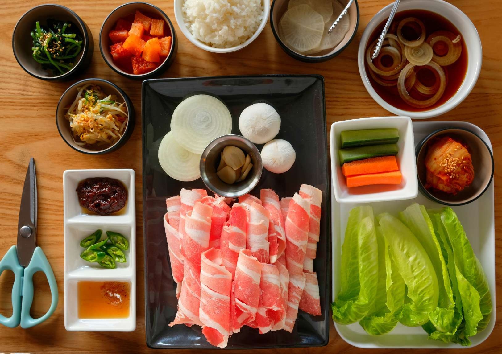 Gogi’s beef brisket BBQ set, with banchan, rice, vegetables and lettuce