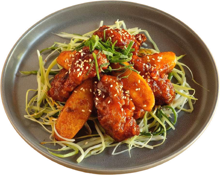 Gogi sweet-and-spicy Korean fried chicken with rice cakes, sesame and spring onion